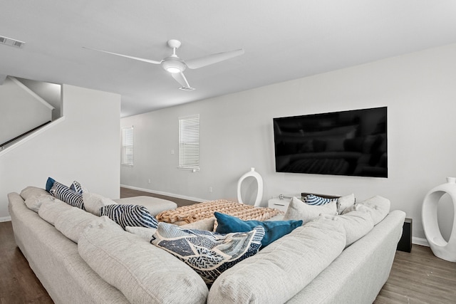 living room with hardwood / wood-style floors and ceiling fan