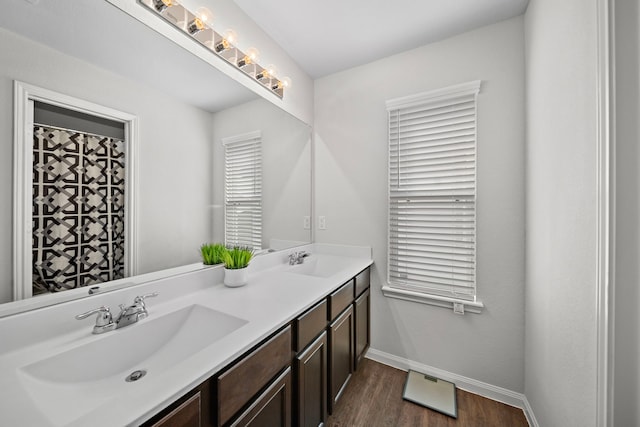 bathroom featuring vanity and wood-type flooring