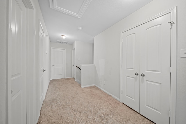 corridor with light colored carpet