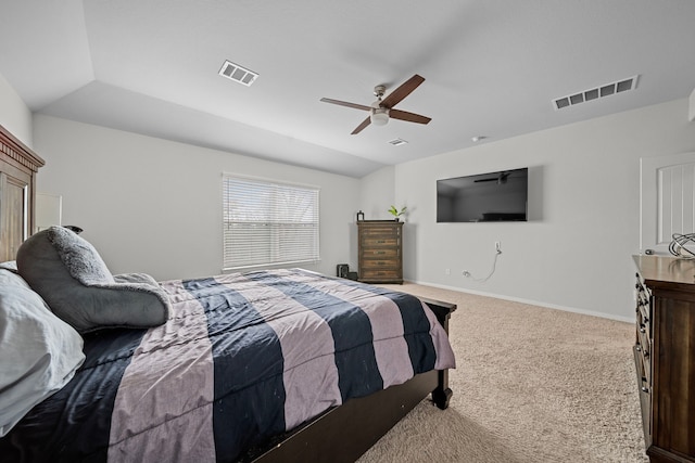 carpeted bedroom with vaulted ceiling and ceiling fan