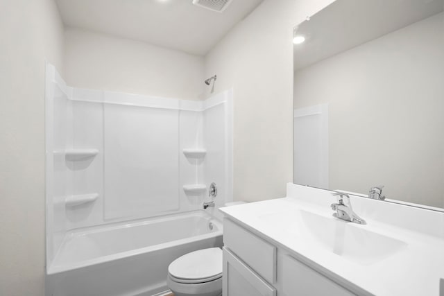 full bathroom featuring vanity, bathtub / shower combination, and toilet