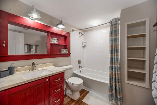 full bathroom featuring hardwood / wood-style flooring, vanity, shower / bathtub combination with curtain, and toilet