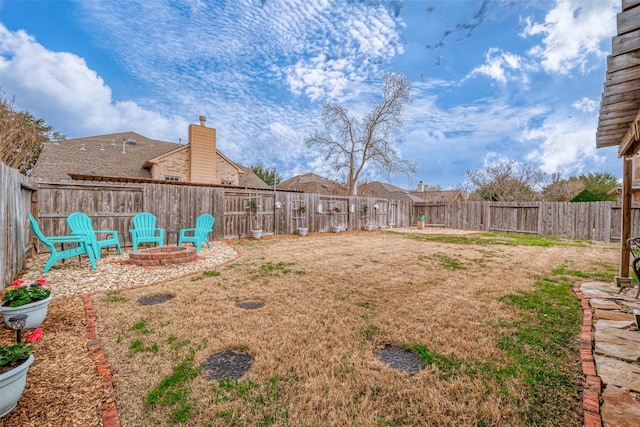 view of yard with an outdoor fire pit