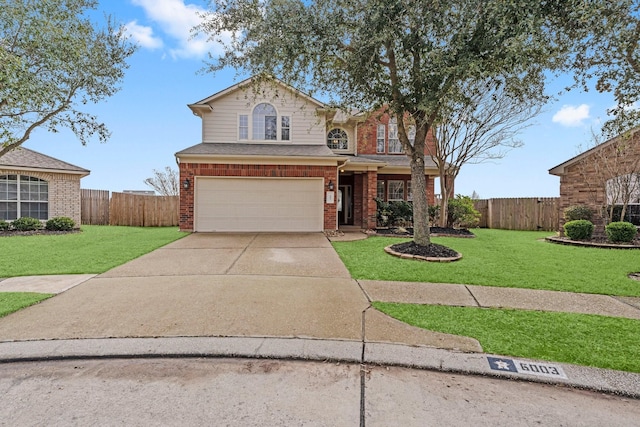 traditional home featuring brick siding, an attached garage, a front yard, fence, and driveway