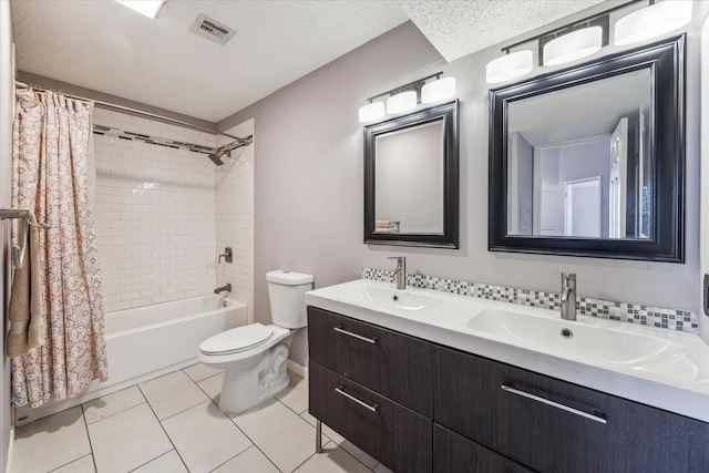 full bathroom featuring tile patterned floors, toilet, shower / tub combo, a textured ceiling, and vanity