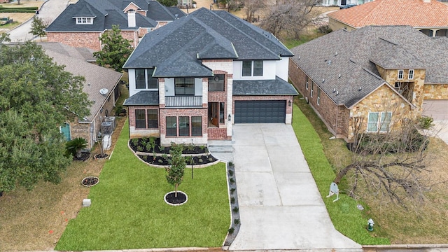 view of front facade with a garage and a front yard