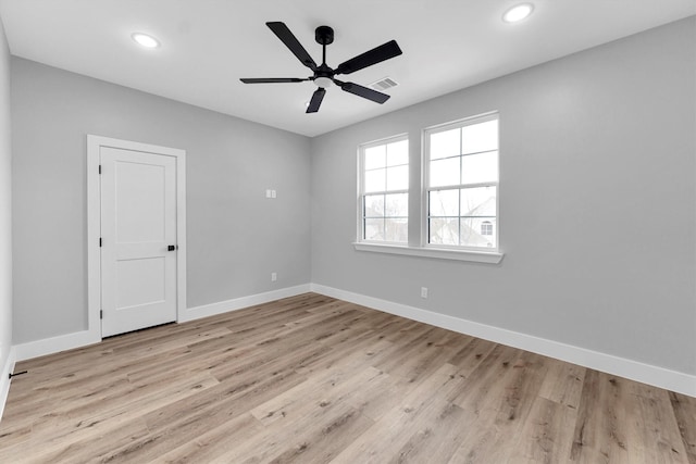 spare room with ceiling fan and light hardwood / wood-style floors