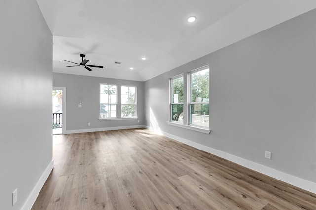 unfurnished living room featuring lofted ceiling, ceiling fan, and light hardwood / wood-style flooring