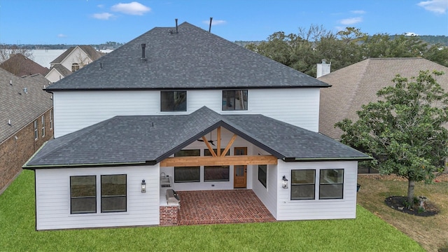 back of house featuring a lawn