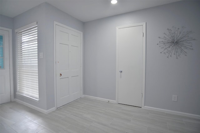 unfurnished bedroom with baseboards