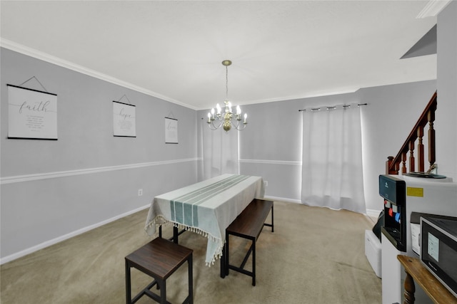 dining space featuring light carpet, a notable chandelier, and ornamental molding