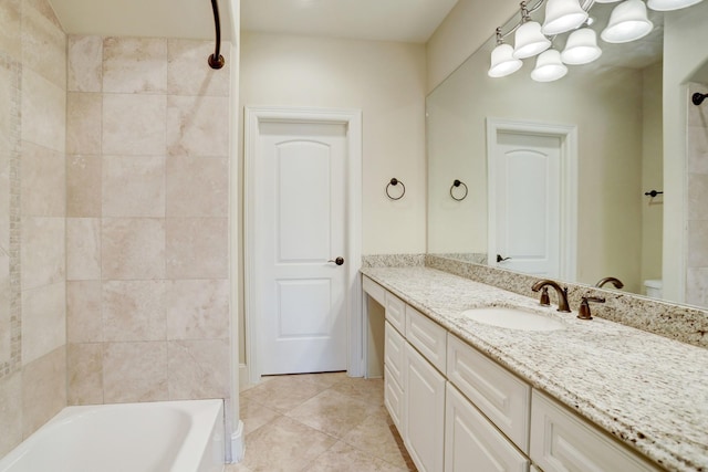 bathroom featuring tile patterned flooring and vanity