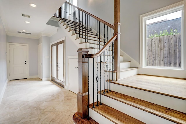 stairway with crown molding