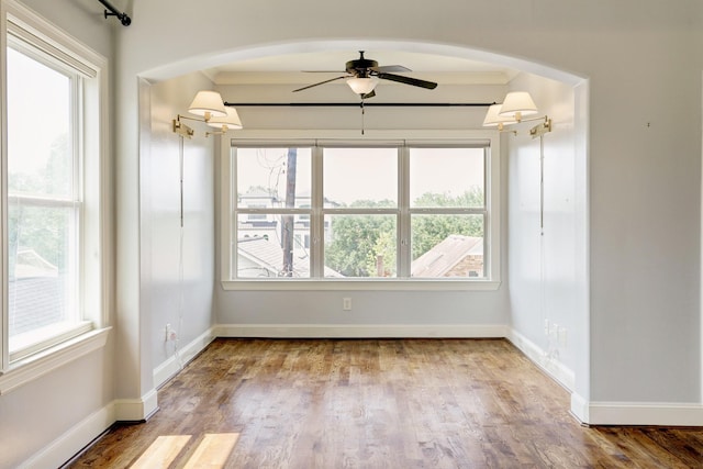 unfurnished room featuring hardwood / wood-style flooring and ceiling fan