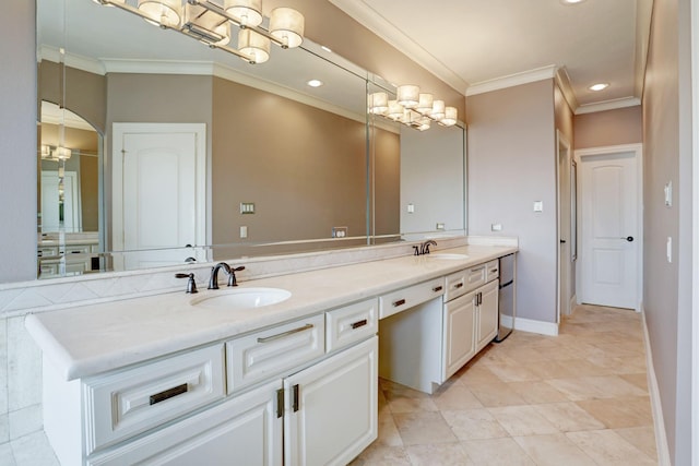 bathroom with vanity and ornamental molding