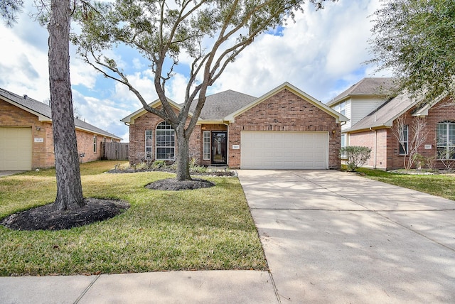 ranch-style home with a garage and a front yard