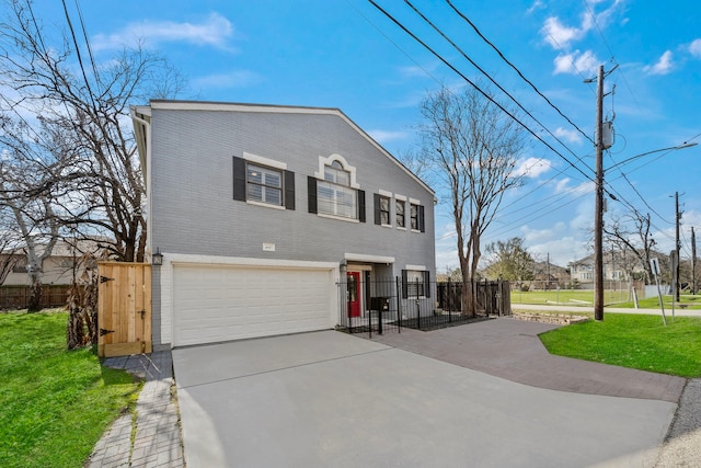 view of front facade featuring a garage and a front lawn