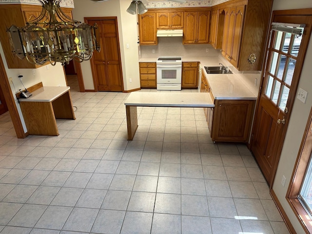 kitchen with sink, light tile patterned floors, hanging light fixtures, and white range with electric stovetop