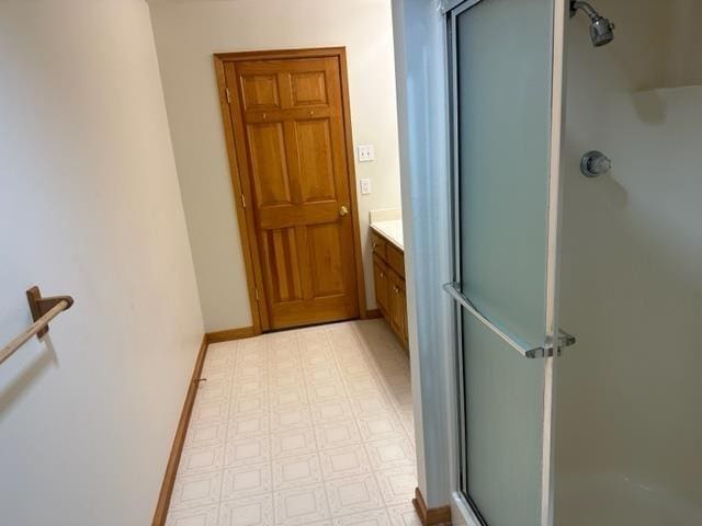 bathroom featuring vanity and walk in shower