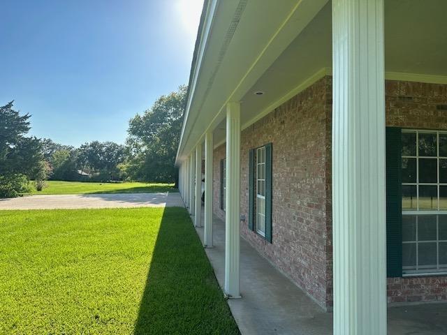 view of property exterior featuring a lawn