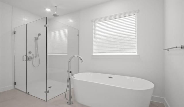 bathroom with shower with separate bathtub