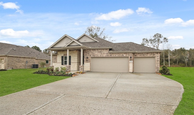 view of front of property with a garage, cooling unit, covered porch, and a front lawn