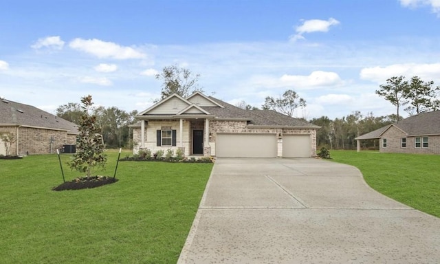 view of front facade with a garage, cooling unit, and a front lawn