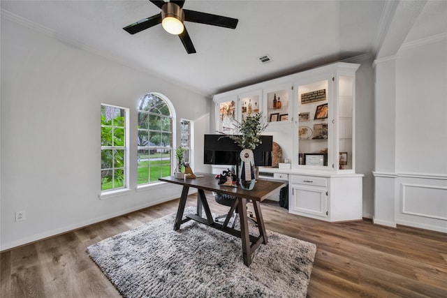 home office featuring hardwood / wood-style flooring, crown molding, and ceiling fan