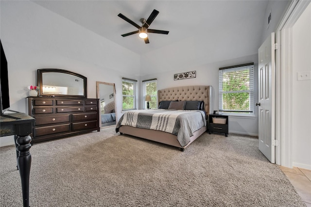 carpeted bedroom featuring lofted ceiling and ceiling fan