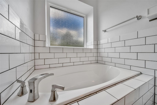 bathroom with a relaxing tiled tub