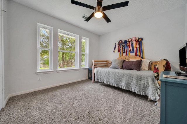 carpeted bedroom featuring ceiling fan