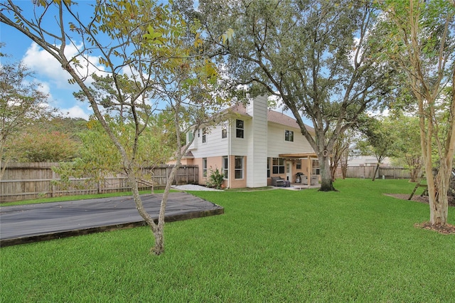 view of yard with a wooden deck