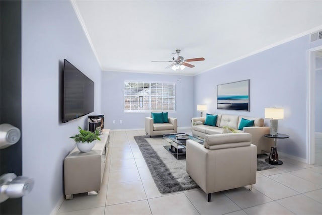 living room with ceiling fan, ornamental molding, and light tile patterned floors