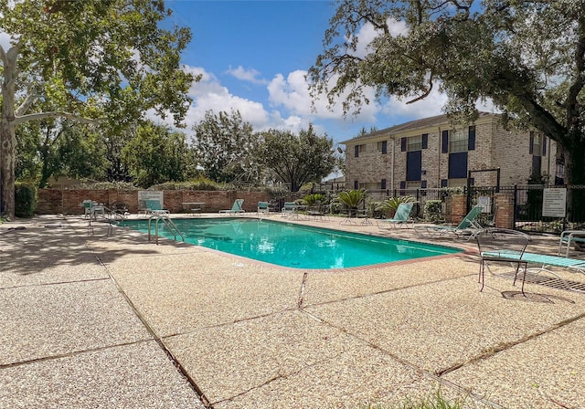 view of swimming pool featuring a patio area