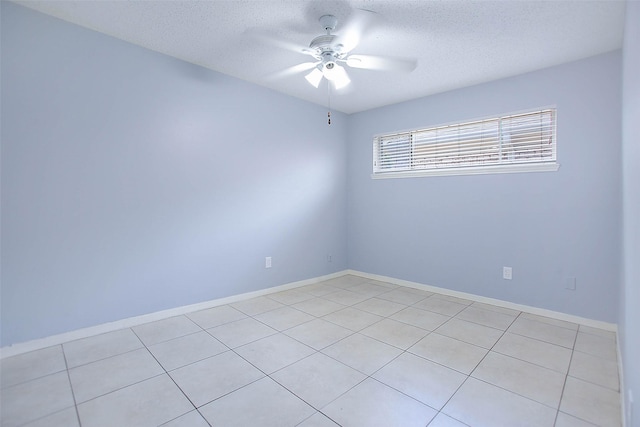 unfurnished room featuring ceiling fan and a textured ceiling