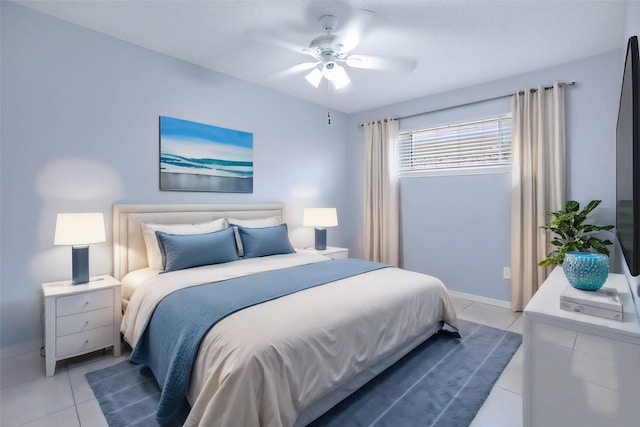 bedroom with tile patterned floors and ceiling fan