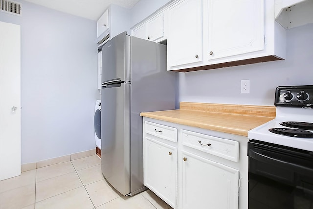 kitchen with white cabinetry, extractor fan, electric range oven, and stainless steel refrigerator