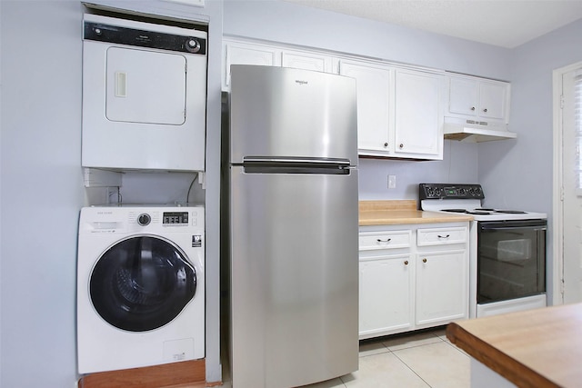 washroom with stacked washer and dryer and light tile patterned floors