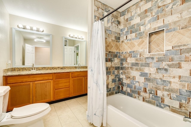 full bathroom featuring vanity, toilet, tile patterned flooring, and shower / bath combo with shower curtain