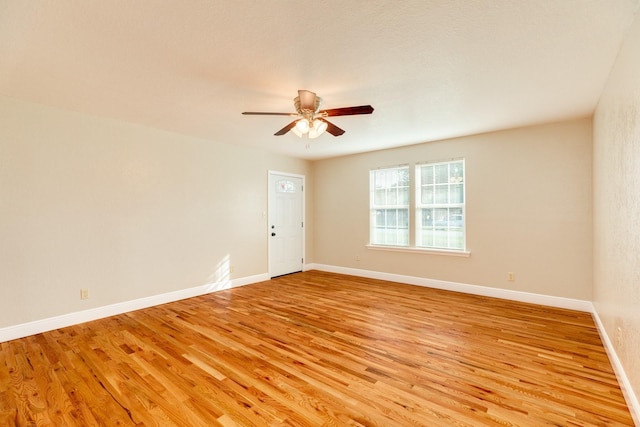 unfurnished room with ceiling fan and light wood-type flooring