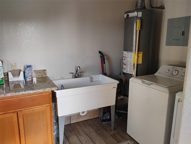 laundry area with cabinets, washing machine and clothes dryer, electric panel, and water heater