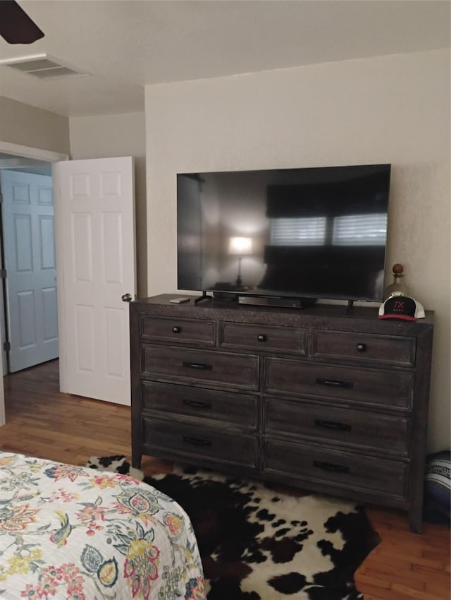 bedroom featuring dark hardwood / wood-style flooring