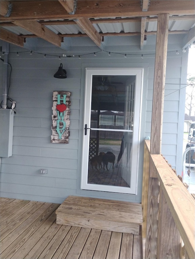 doorway to property featuring a wooden deck