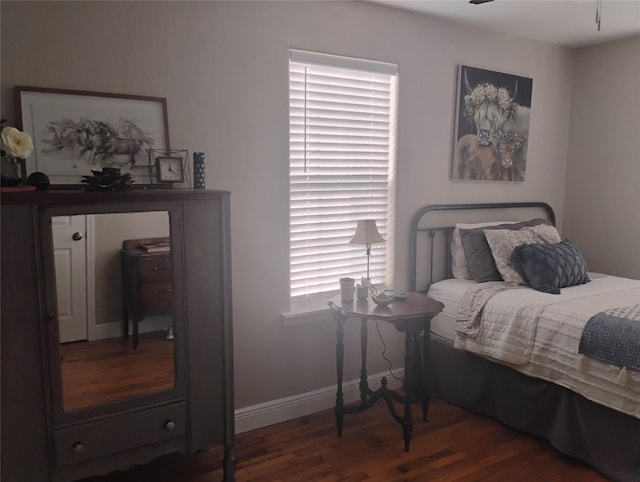 bedroom featuring dark wood-type flooring