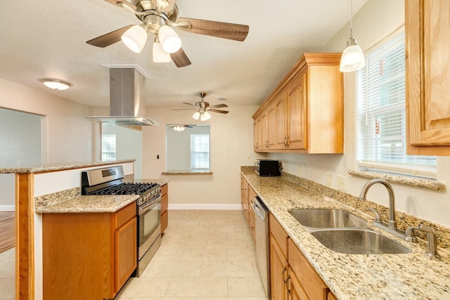 kitchen with sink, decorative light fixtures, plenty of natural light, island exhaust hood, and stainless steel appliances