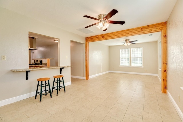 interior space featuring ceiling fan