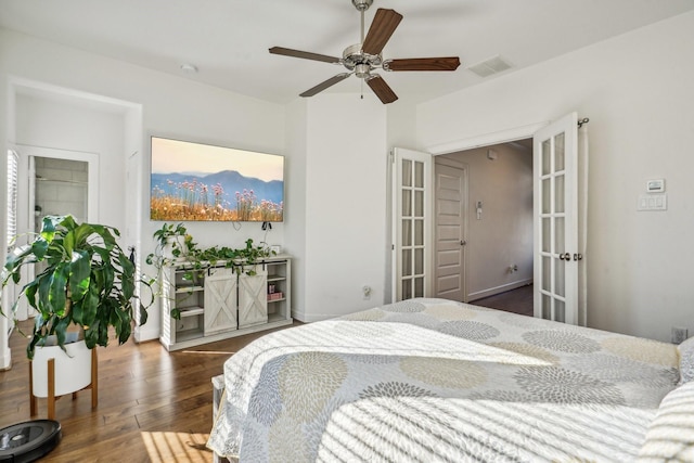 bedroom with ceiling fan and dark hardwood / wood-style flooring