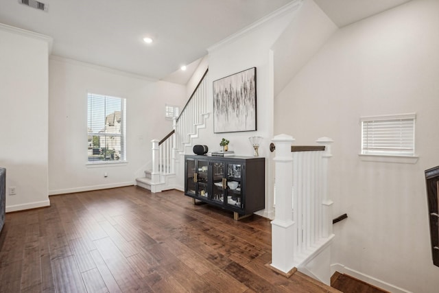 interior space with hardwood / wood-style flooring and crown molding