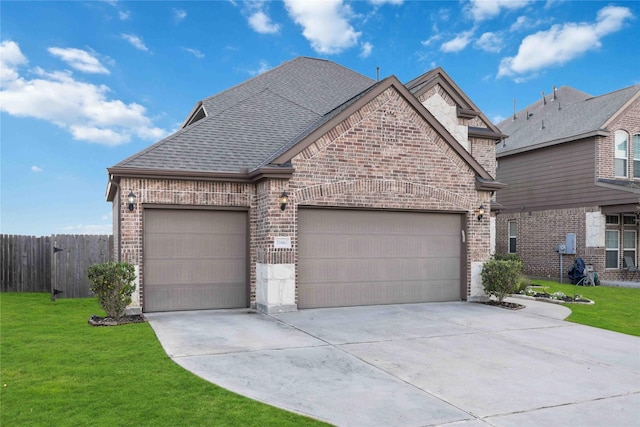 view of front facade with a garage and a front yard