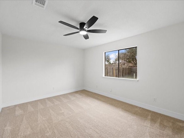 carpeted empty room with ceiling fan